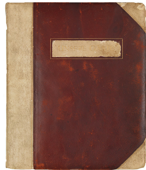 Book with leather binding embossed with the words "Our Guests"