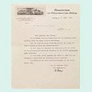 Typewritten letter with letterhead, including the vignette of a building