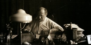 Constantin Brunner sitting at his desk