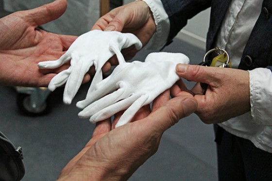 Four hands and one pair of white gloves