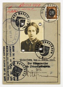 A passport with a photo and several stamps