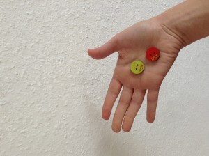 The buttons are presented  on the palm of one's hand