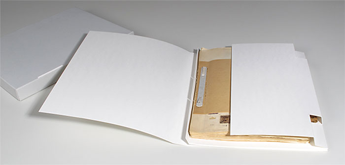 The restored stamp album in its inner packaging, with the archive box to its left