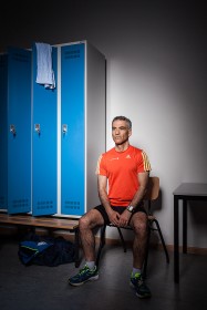 Portrait of a man in sports wear in a locker room
