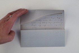 Reconstruction based on to-scale photo prints: The double-layer page with the message was folded in such a way as to conceal the content within.