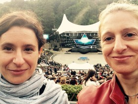 Selfie of two women in front of a stage