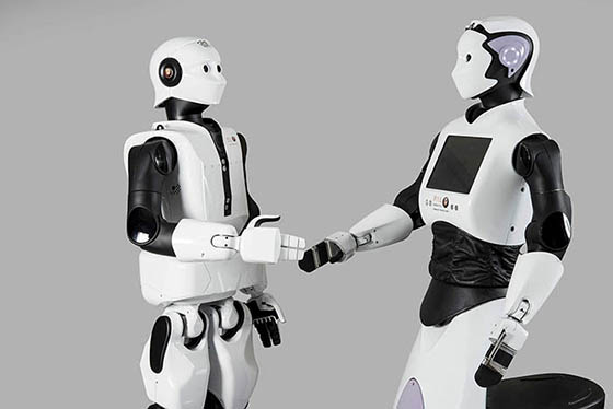 Two humanoide robots greet each other