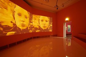 Red room with three-part film screen