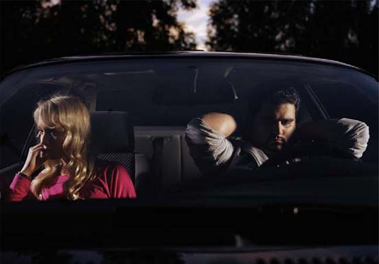 Photo of two people in a car