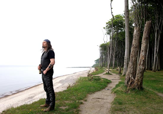 Man standing on a sea coast