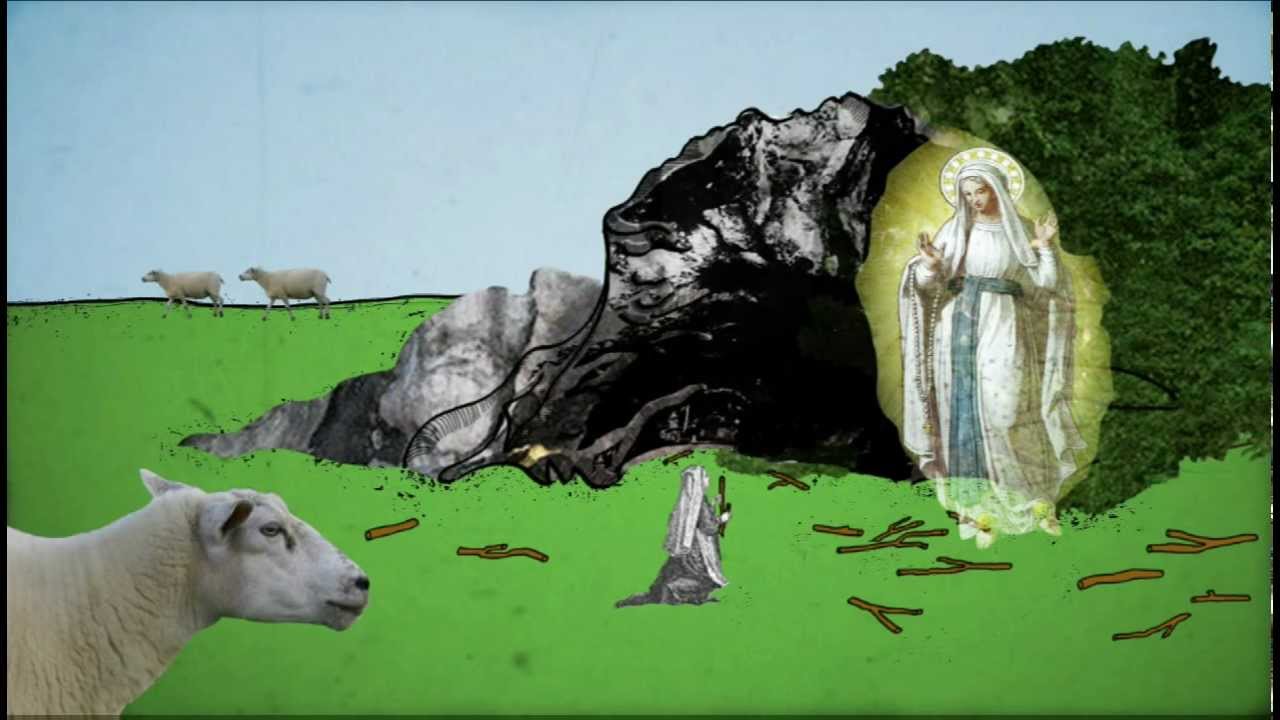 Graphic shows the apparition of Mary in Lourdes in front of a rock on a green meadow with a kneeling woman and grazing sheep.