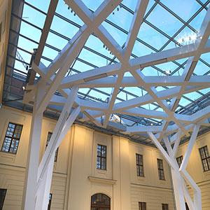 Interior view of the glass courtyard with special attention to the steel construction on the ceiling.