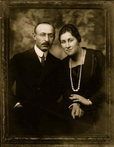 Portrait of Bernhard and Paula Lustig, taken in a studio, both looking into the camera