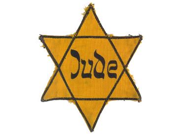 Sechszackiger gelber Stern mit der Aufschrift „Jude“