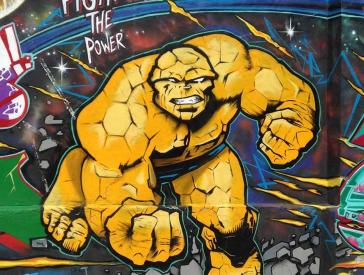 Graffiti with yellow action figure