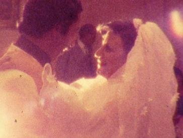 An old photograph: a wedding couple dancing.