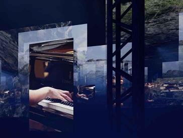 Projected images in the room, on one a hand on the piano