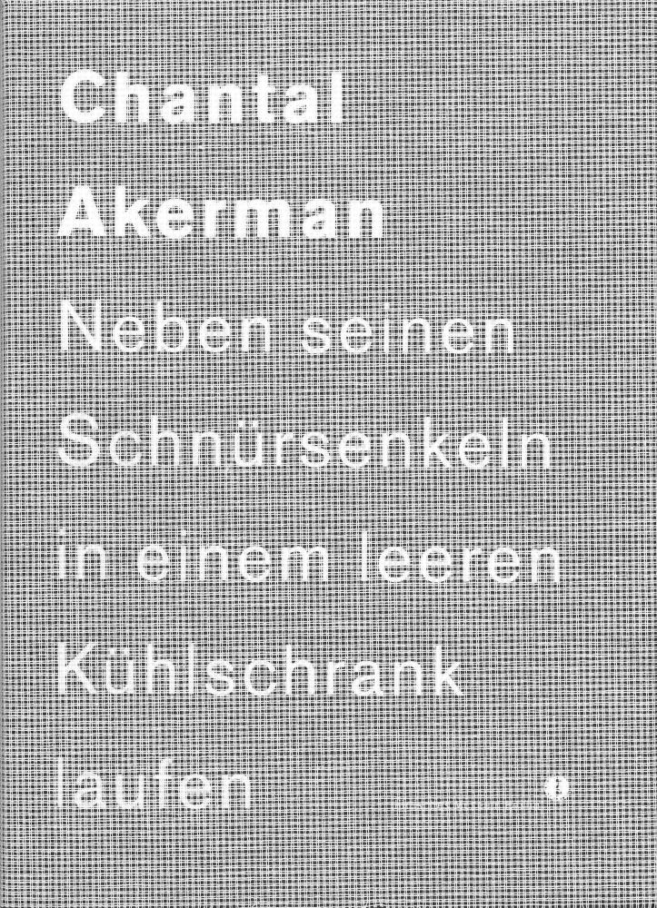 Book cover of “Chantal Akerman”: black, grey and white plaid pattern with white text „Chantal Akerman Naben seinen Schnürsenkeln in einem leeren Kühlschrank laufen“.