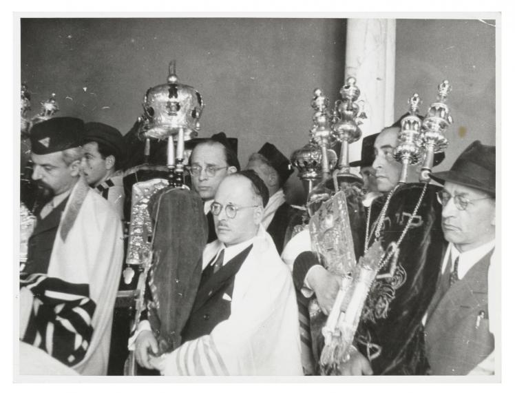 Black-and-white photograph of a group of people at the reconsecration of a synagogue