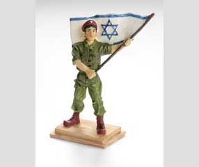 Triptych: Figurine of Israeli paratrooper waving flag - Judaica Heaven.com, Monsey NY, 2007 - Plastic