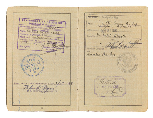 Open passport with handwritten entries and stamps