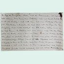 Handwritten sheet of paper in vertical format with folds and stains