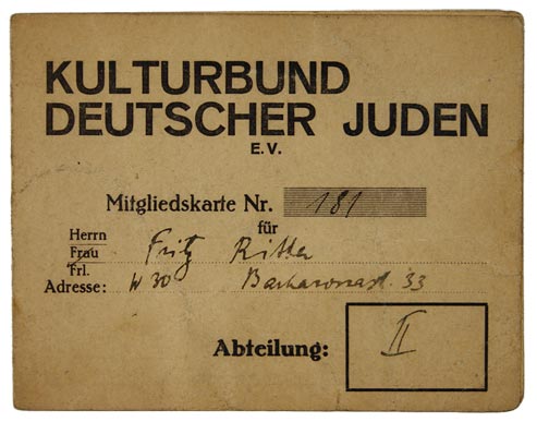 Front of a yellowed membership card filled out by hand