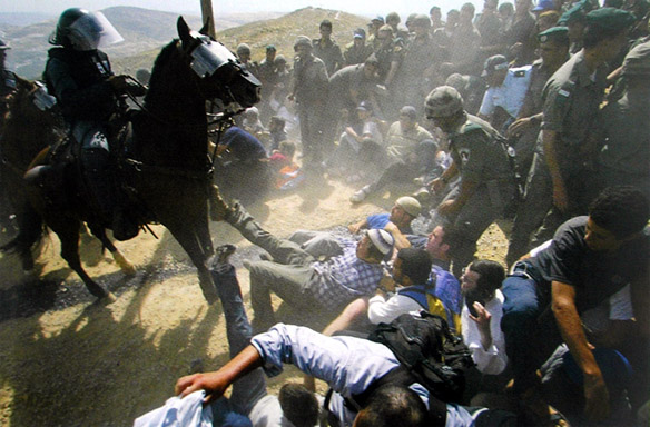 Pavel Wolberg: Israeli police confront the Jewish demonstrating settlers during the evacuation of Mitzpeh Yitzhar