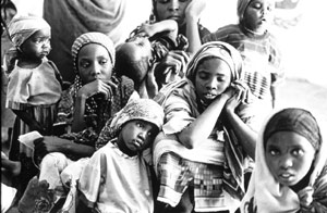 A Darfurian mother and her children arriving in a refugee camp in eastern Chad - © Mark Brecke