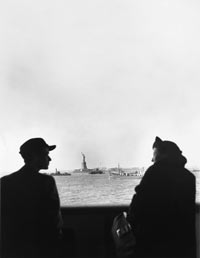 Wolf (1922-1973) and Luta Vishniac (1899-1998) at the railing of the "S.S. Siboney" shortly before arriving at New York harbor, 12/31/1940, photograph by Roman Vishniac