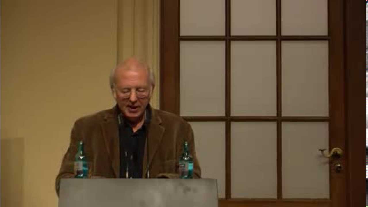 Man stands at a lectern and gives a lecture.