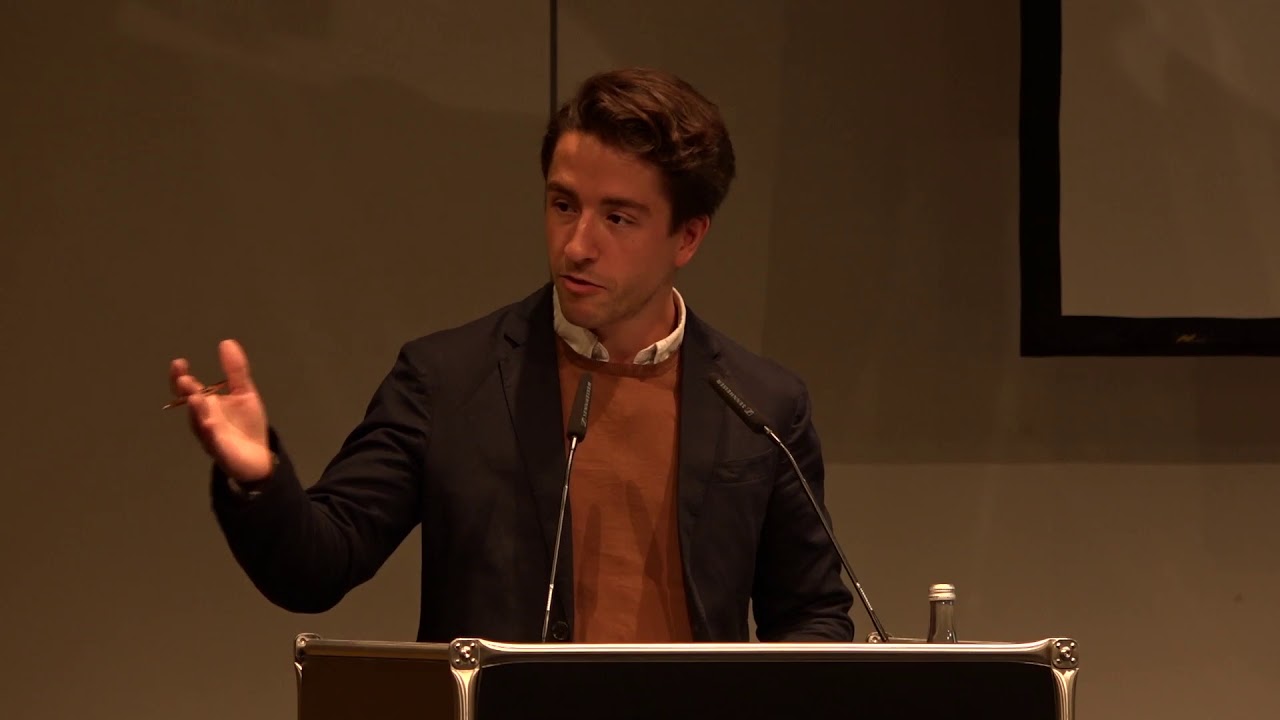 Man speaking at the lectern.