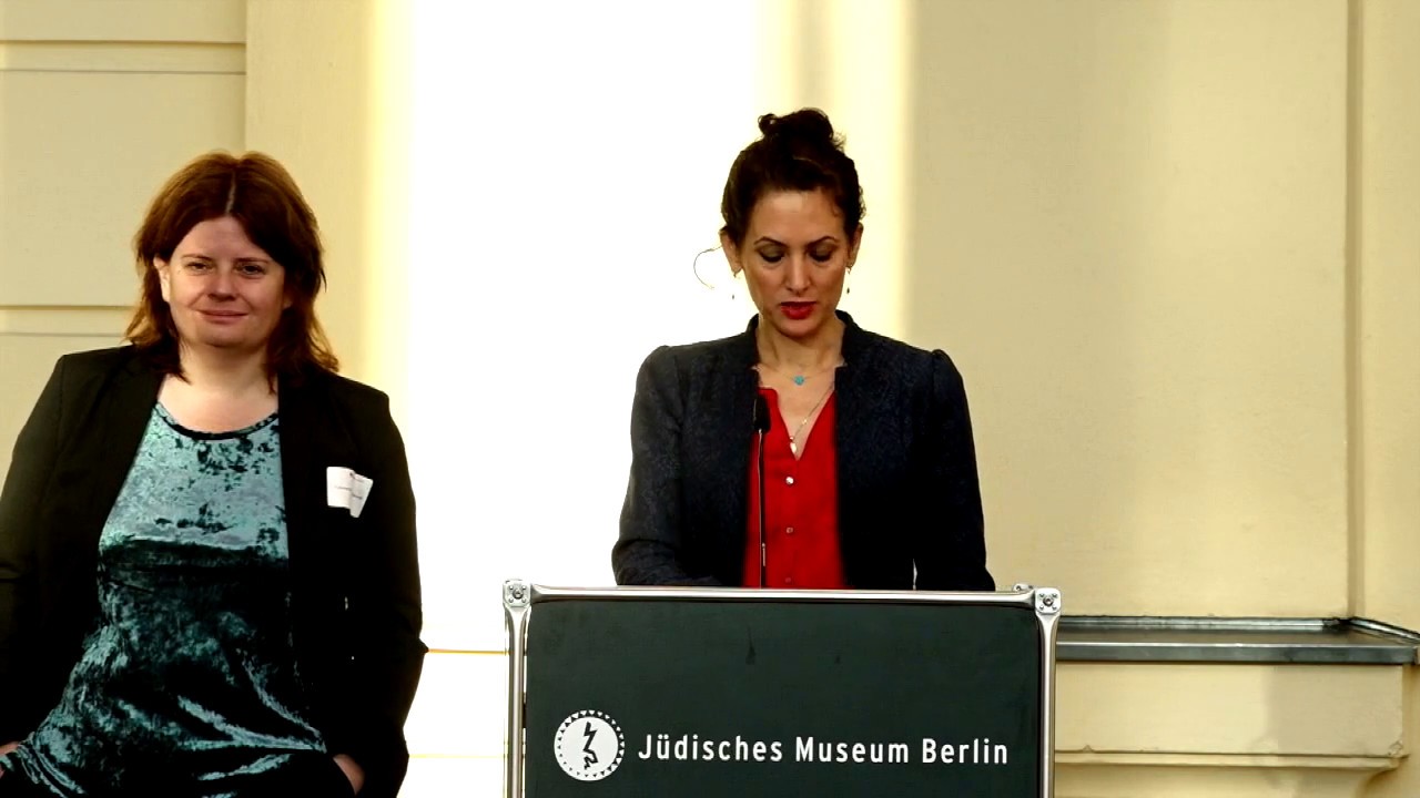 Woman speaking at the lectern.