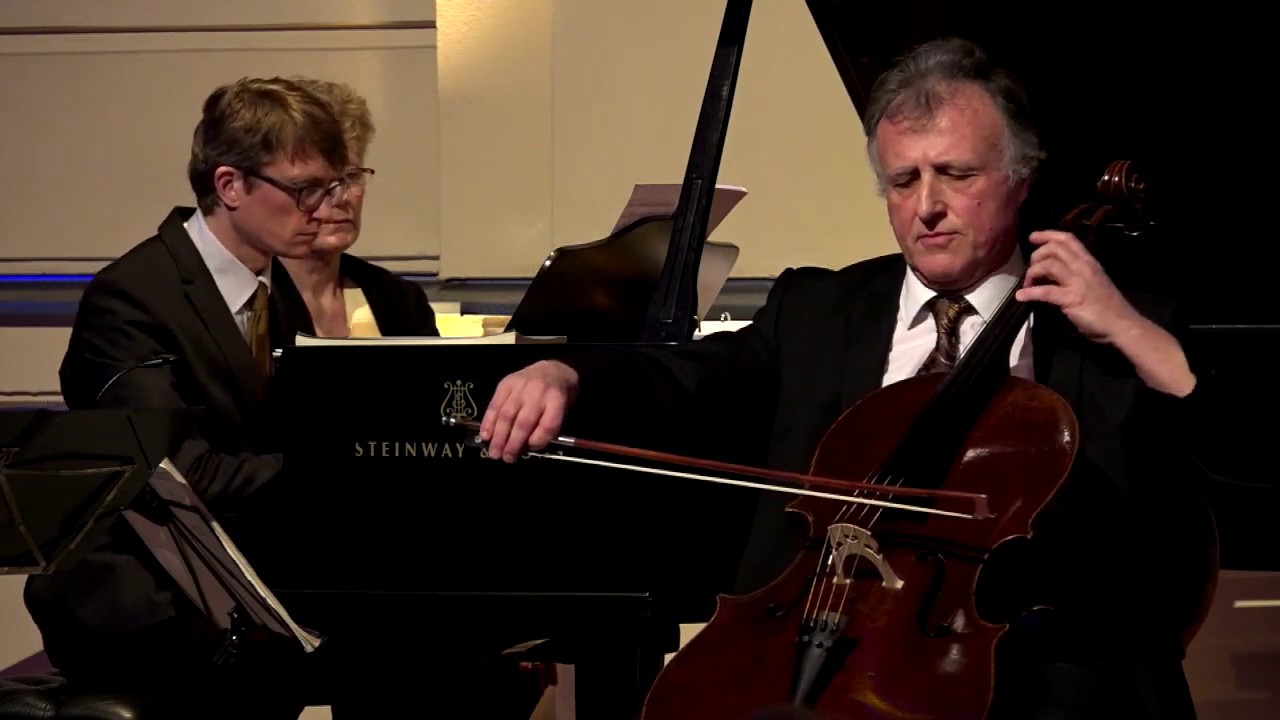 A cello player and a pianist make music.