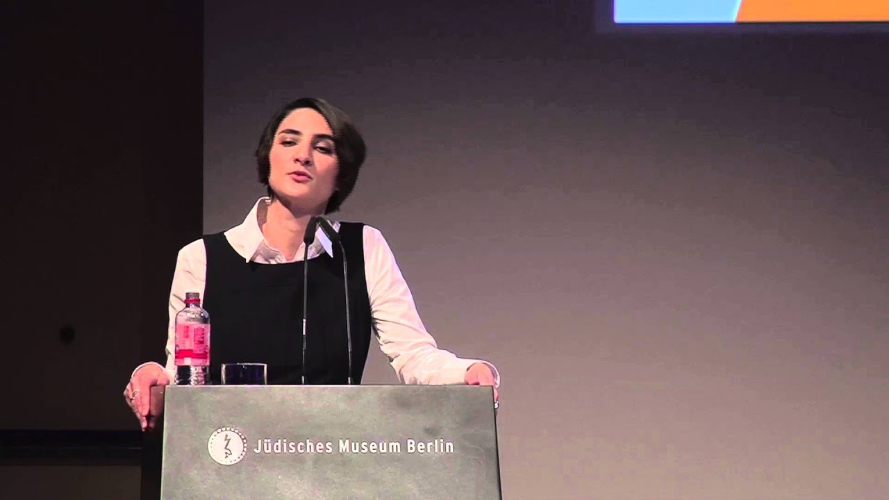 Woman at the lectern gives a speech.