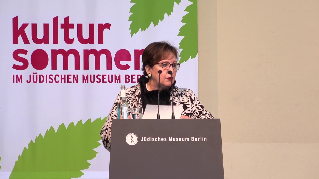 Woman speaking at the lectern.