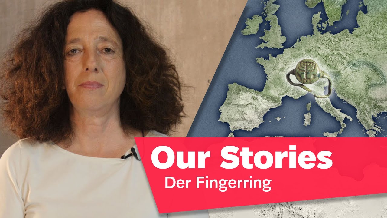 Portrait photo of Miriam Goldmann, in the background a ring and a map of Europe, in the lower right corner of the picture the inscription “Our Stories: Der Fingerring” (The Ring).