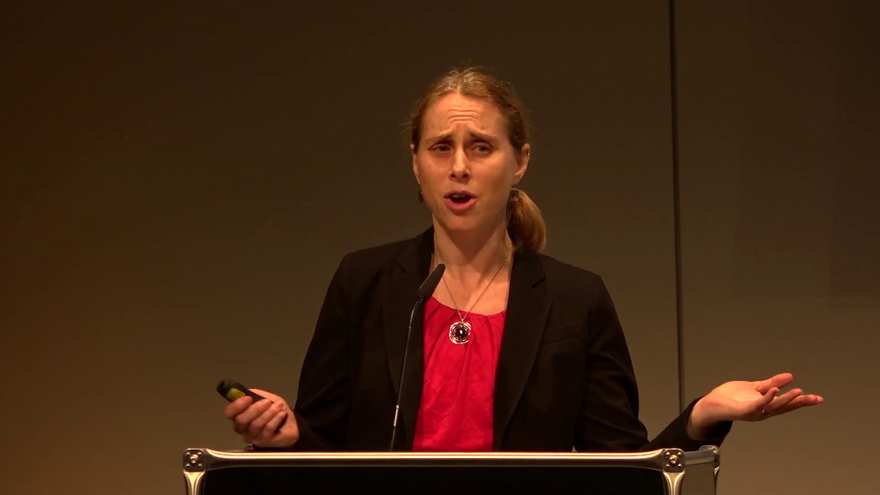 Jill Jacobs stands at the lectern