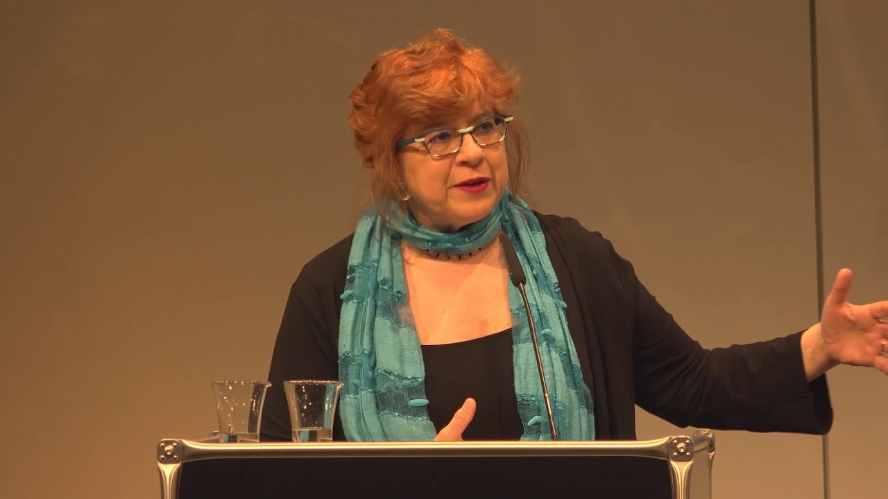 Susannah Heschel stands at the lectern