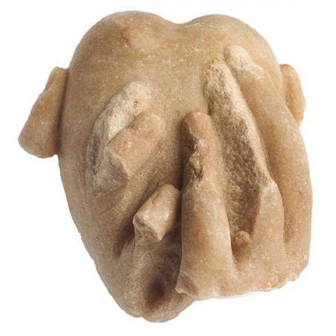 Marble fragment: a hand encloses a heart