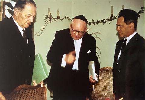 Photograph of three men in suits and kippot