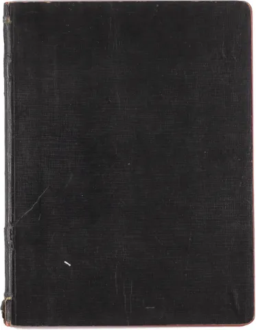 A worn notebook with a dark-brown cover