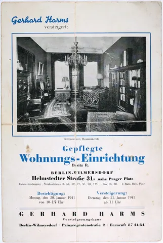Old advertisement for an auction house. It shows the furnishings of a gentleman's study. 
