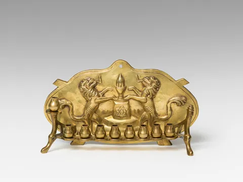  Golden Hanukkah candlestick with decorations.