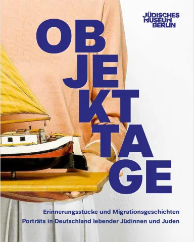 Book cover with picture detail showing a person, of whom only the hull is visible, holding a wooden board with a model ship, above the picture the book title: “Object Days. Memorabilia and migration stories. Portraits of Jews living in Germany.”