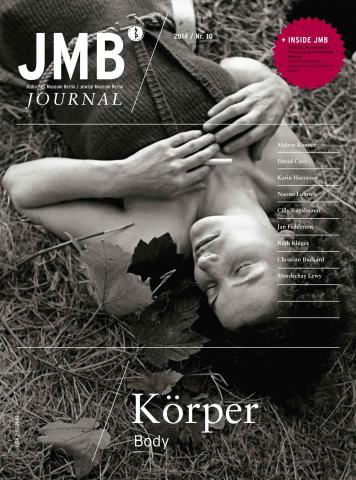 Cover of “Body”, Journal Ten: black and white photo of a woman smiling with her eyes closed laying down in in the grass and leaves.