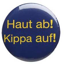 Blue circular button with the yellow german text "Haut ab! Kippa auf!" written on it 