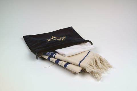 A Tallit (prayer shawl) with tzitzit (tassels)