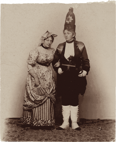 Historical black and white photograph of two women in costumes.
