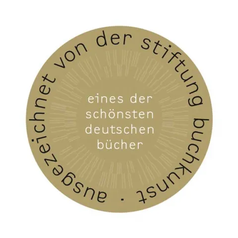 A round gold medallion bearing the inscription: One of Germany’s most beautiful books, awarded by the Stiftung Buchkunst.